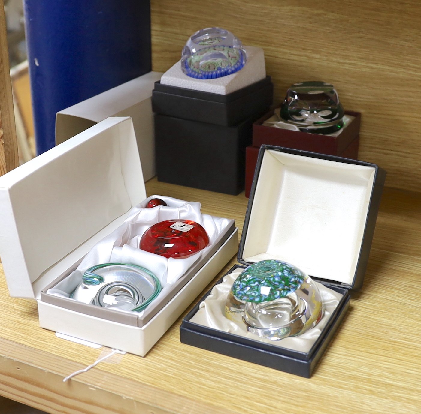 Four boxed paperweights including St Louis Adam & Eve, Baccarat sulphide, Perthshire etc.